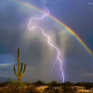 lightning and a rainbow in Tucson, Arizona (Photo via Instagram by @tucsonre)